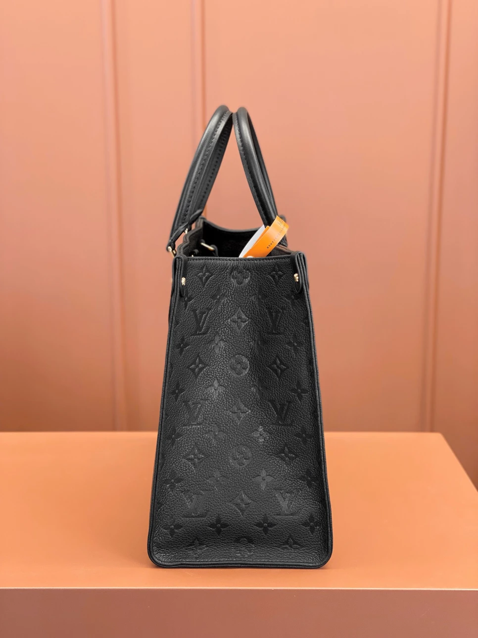 louis-vuitton-lv-monogram-empreinte-leather-onthego-mm thumbnail 5
