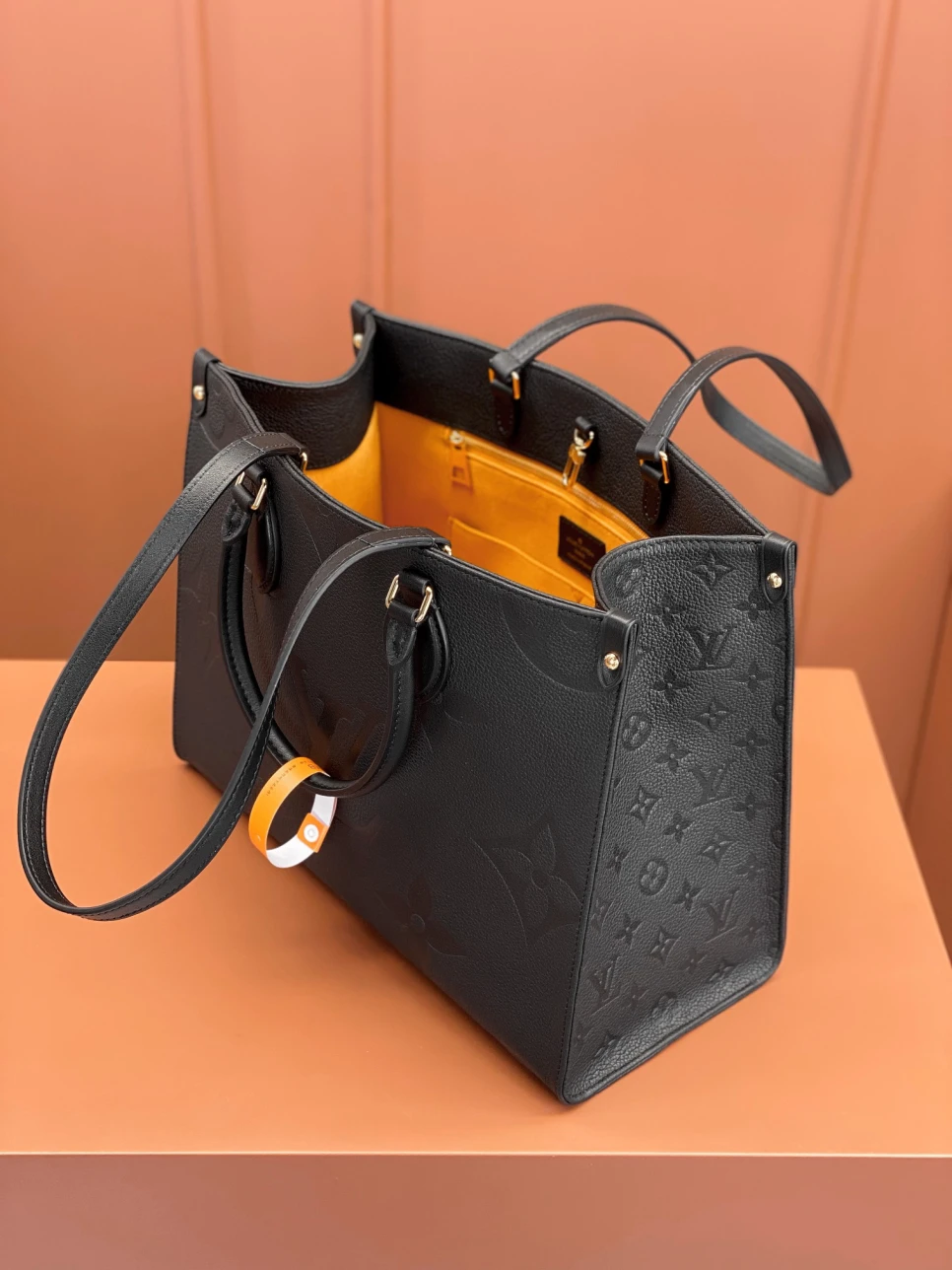 louis-vuitton-lv-monogram-empreinte-leather-onthego-mm thumbnail 8
