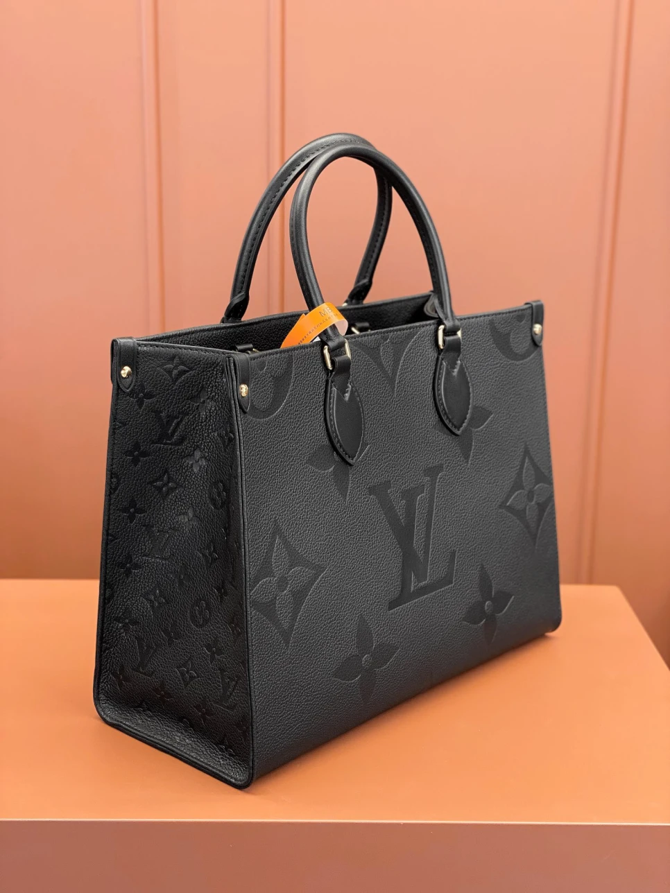 louis-vuitton-lv-monogram-empreinte-leather-onthego-mm thumbnail 3